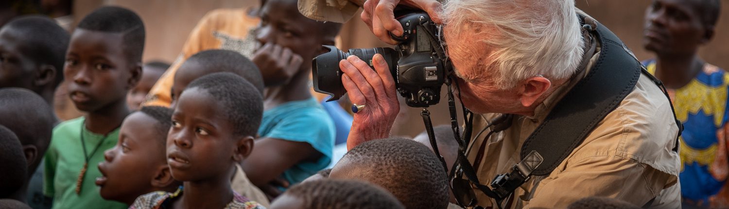 photographer in africa taking pictures during a ceremony