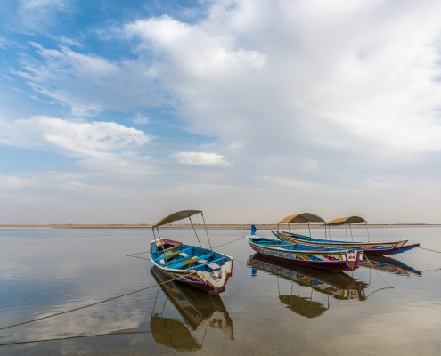 Boats reflecting in the water in Simal