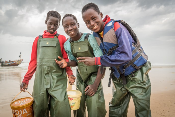 Senegal, young fishermen in the village of Kayar